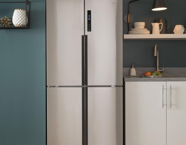 photo of a haier stainless steel quad door refrigerator featured in a contemporary green kitchen - Kitchen Appliance photo of a haier stainless steel quad door refrigerator featured in a contemporary green kitchen - Kitchen Appliance