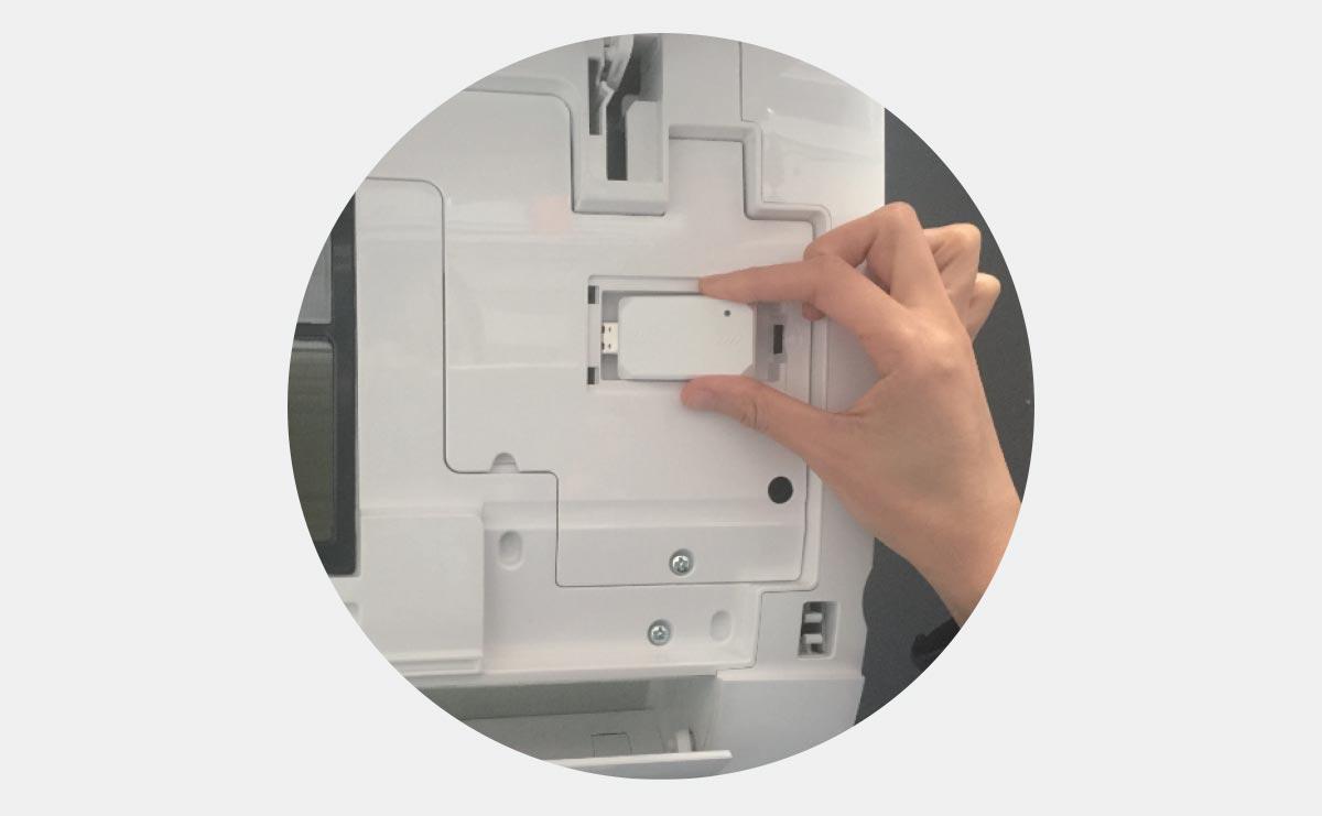 Photo of owner plugging WiFi USB Adapter into ductless wall mounted unit Photo of owner plugging WiFi USB Adapter into ductless wall mounted unit