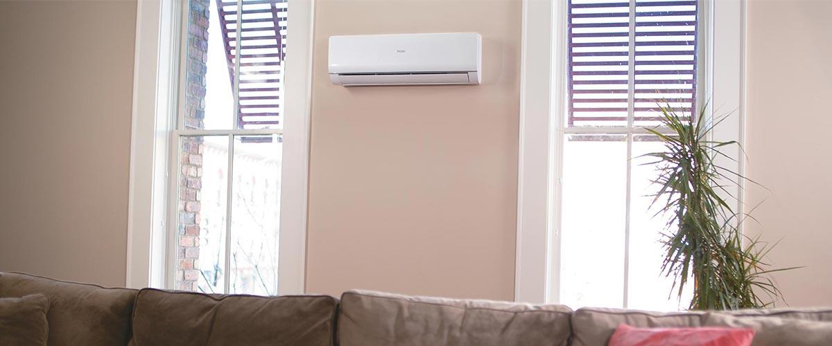 Photo of a Haier ductless wall mount mini split air conditioner installed in a living room Photo of a Haier ductless wall mount mini split air conditioner installed in a living room